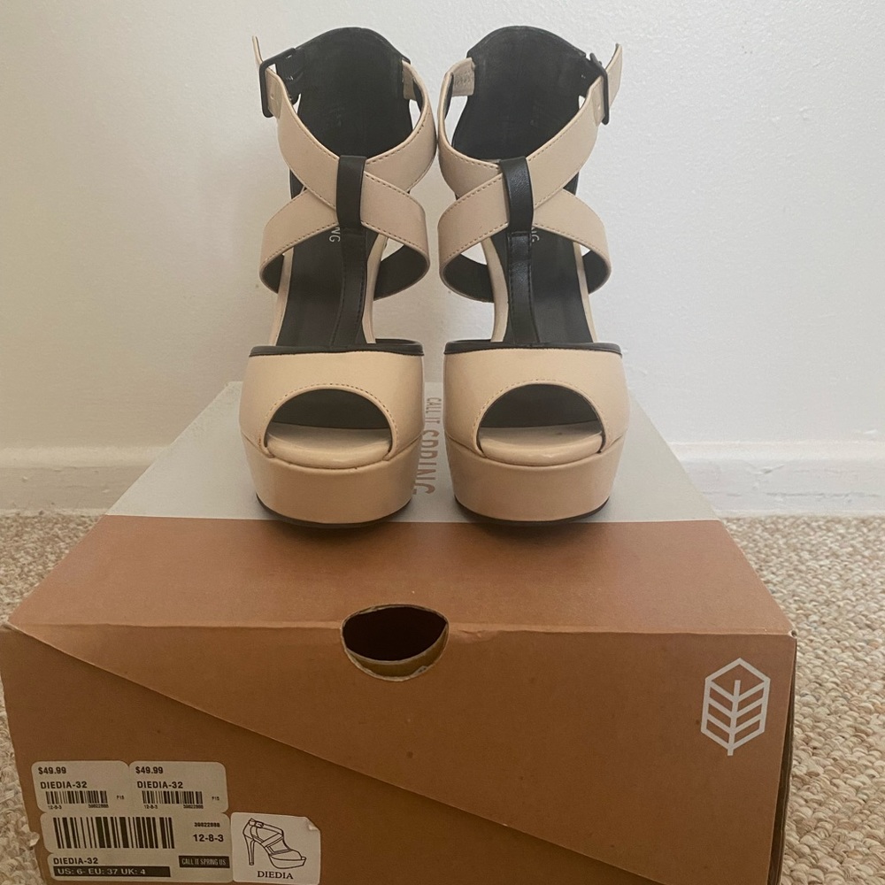 Nude and Black strappy heels.